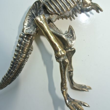 brass dinosaur figurine