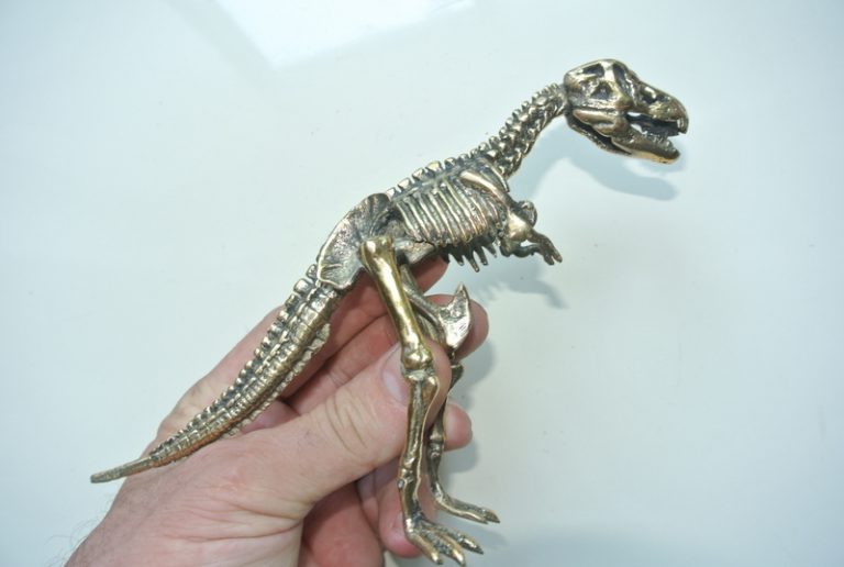 brass dinosaur figurine